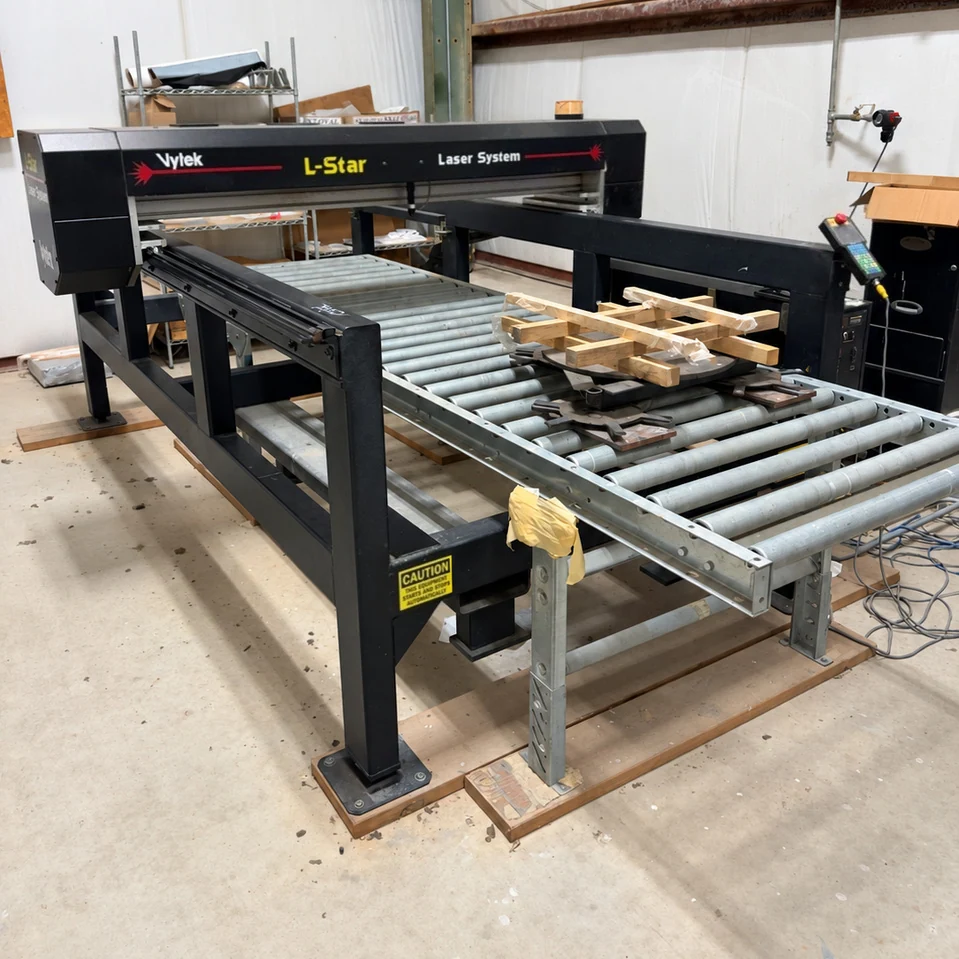 Vytek L-Star laser etching machine and roller table in the Elberton workshop