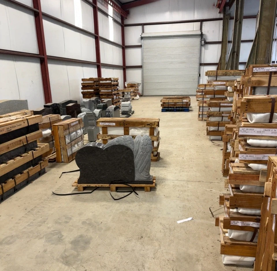 Granite monuments and crated inventory inside the Elberton warehouse